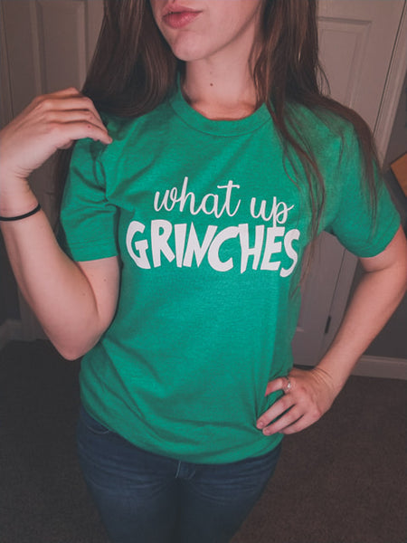 What up Grinches unisex bella tee