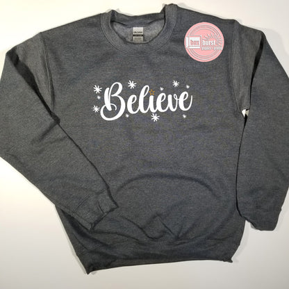 Believe unisex crew neck sweatshirt w/ a sparkle star