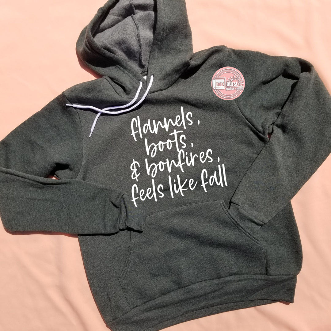 Flannels, Boots, and bonfires unisex bella soft hoodie