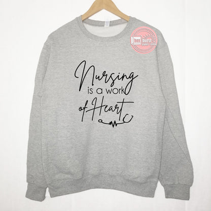 Nursing is a work of heart fleece unisex sweater