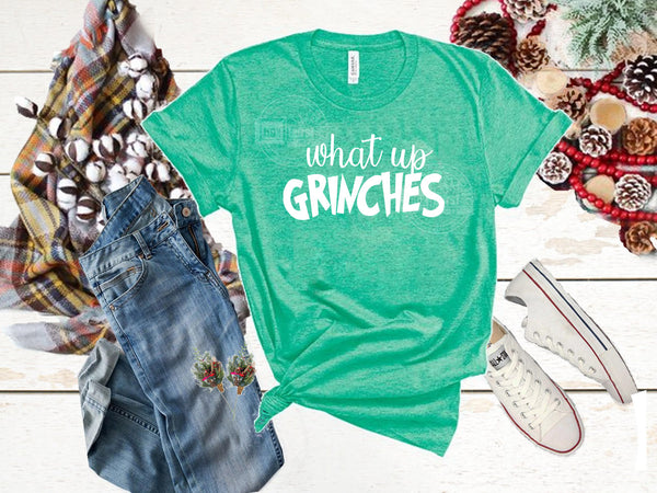 What up Grinches unisex bella tee